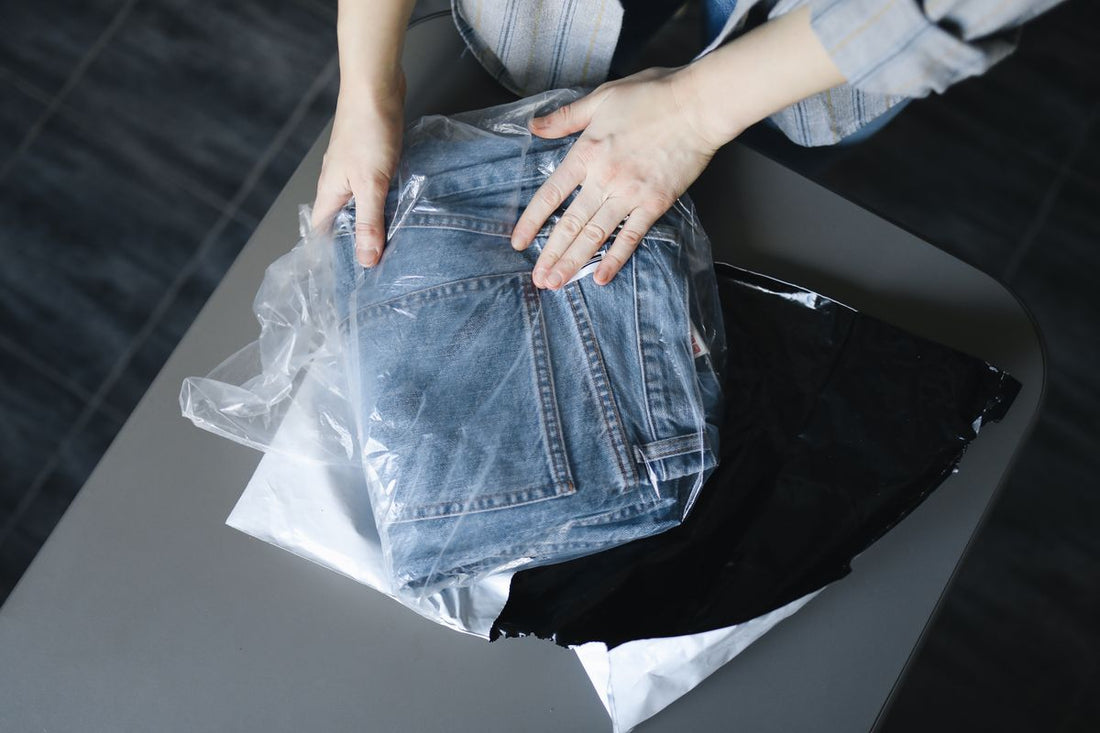 Folding jeans into a poly mailer bag for shipping